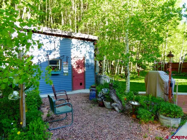 a view of a backyard with plants