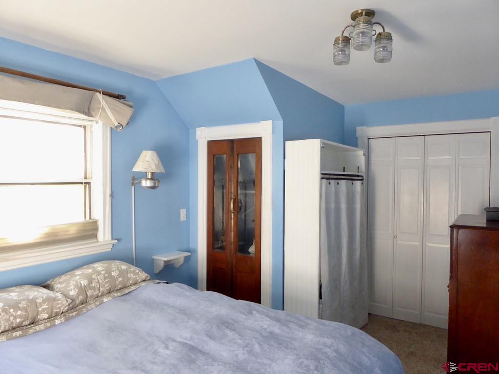 2 River Street Silverton, CO 81433 - Photo 21 of 36 a bedroom with a bed and a window