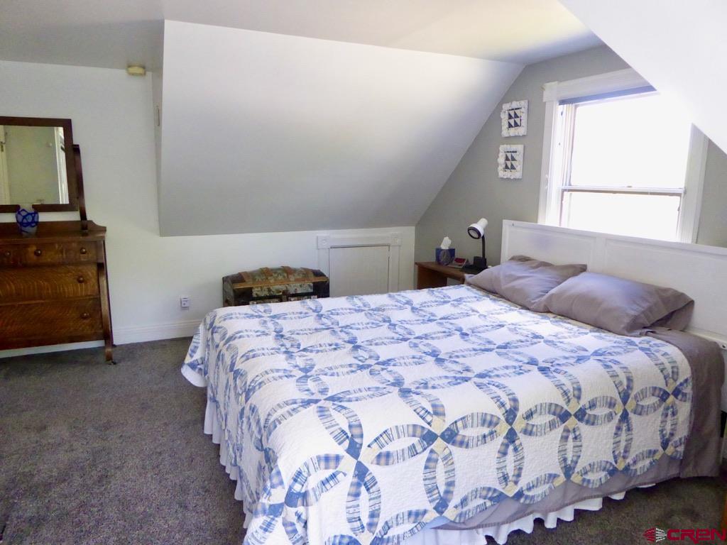 2 River Street Silverton, CO 81433 - Photo 27 of 36 a bedroom with a bed and a window