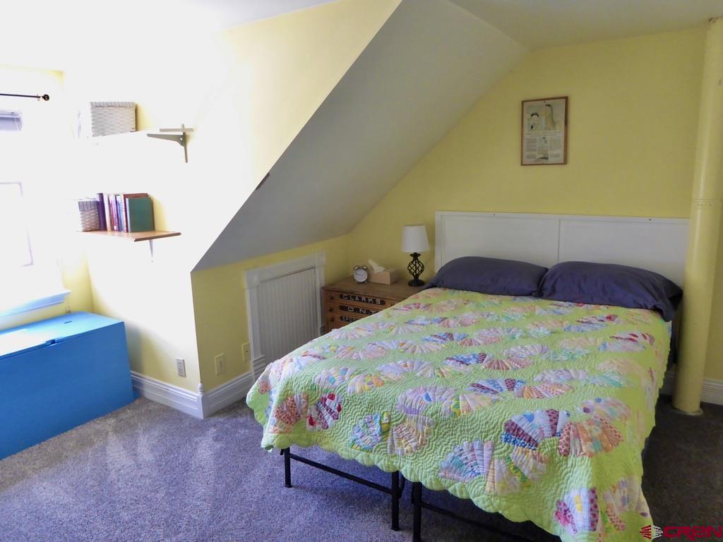 2 River Street Silverton, CO 81433 - Photo 28 of 36 a bedroom with a bed and a dresser