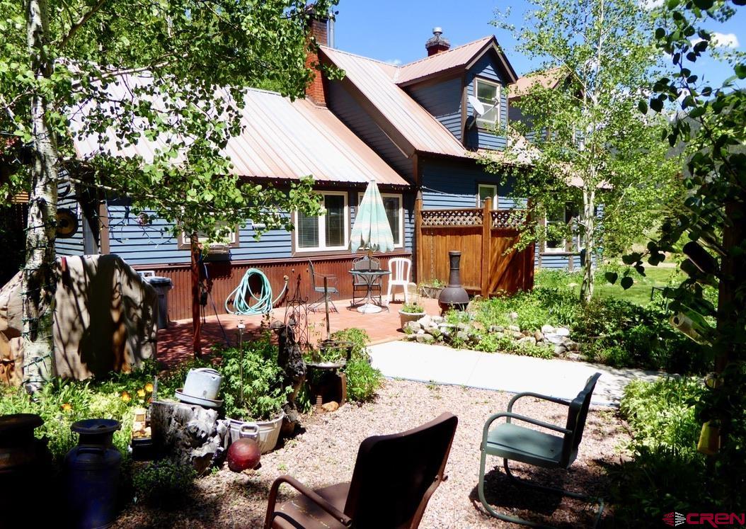 2 River Street Silverton, CO 81433 - Photo 3 of 36 a view of a patio with table and chairs potted plants