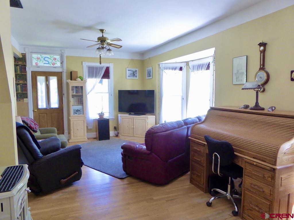 2 River Street Silverton, CO 81433 - Photo 6 of 36 a living room with furniture a chandelier and a window