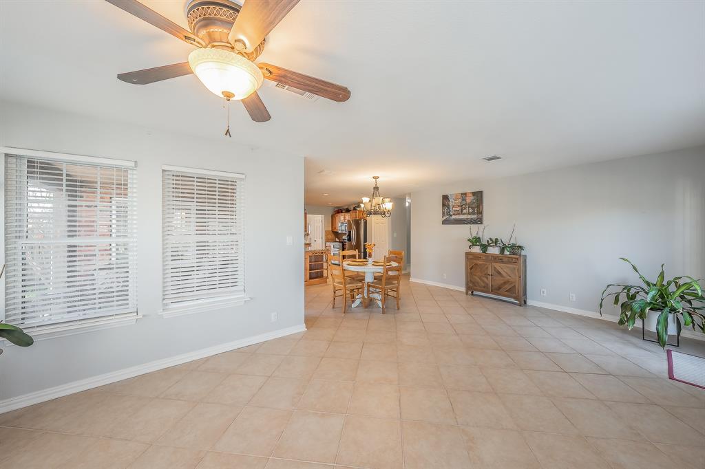 4425 Maple Shade Avenue Sachse, TX 75048 - Photo 16 of 40 a view of a livingroom with furniture and a window