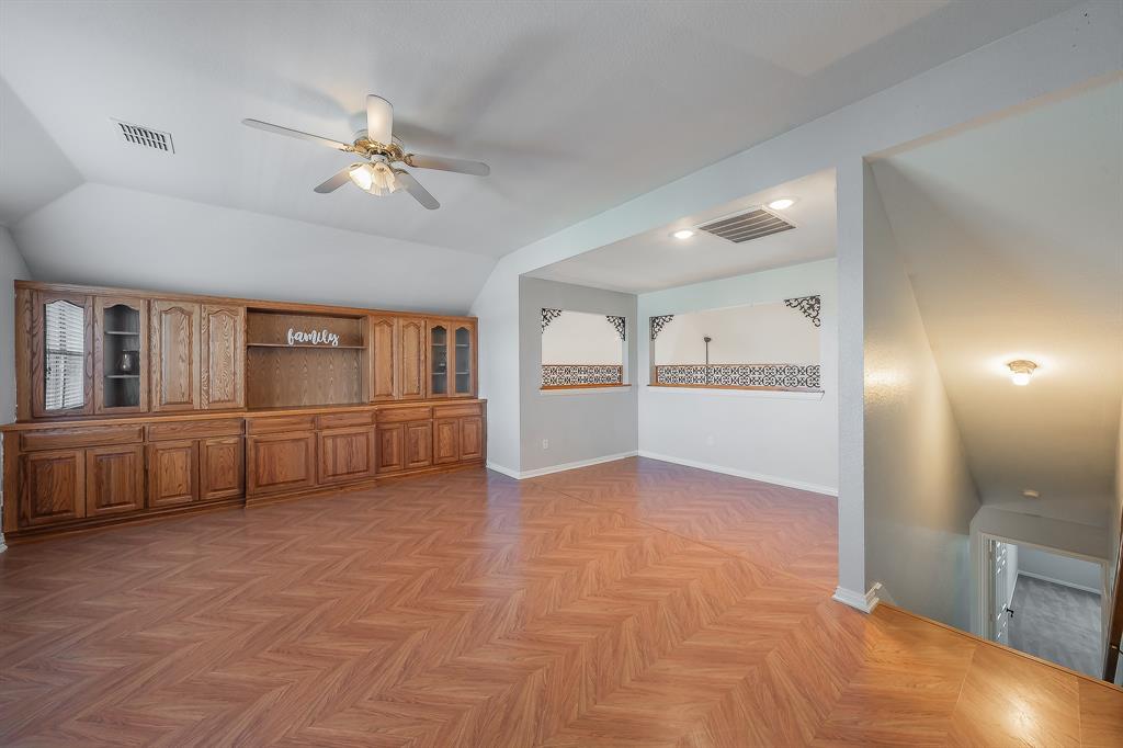 4425 Maple Shade Avenue Sachse, TX 75048 - Photo 24 of 40 a view of a kitchen with furniture and an empty room
