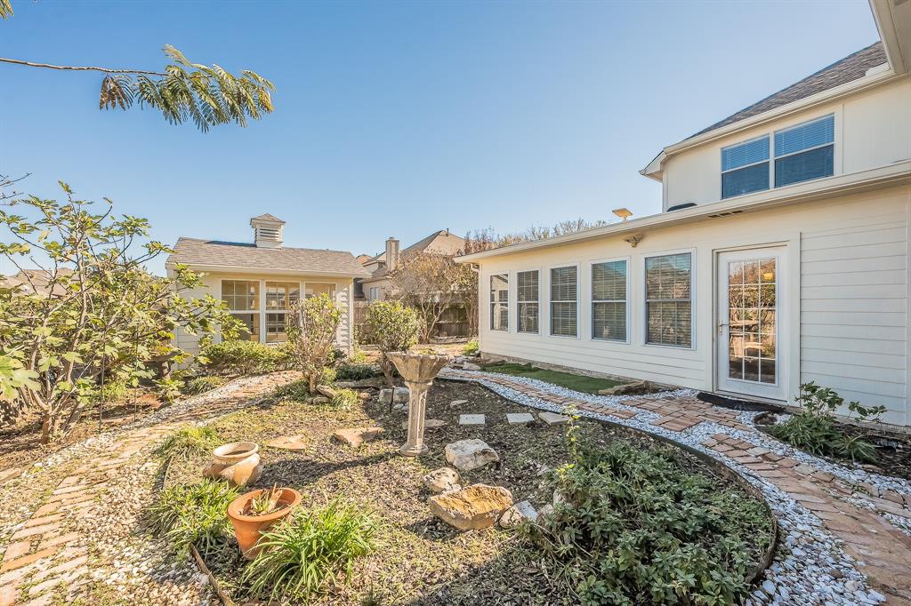 4425 Maple Shade Avenue Sachse, TX 75048 - Photo 32 of 40 a front view of a house with a yard