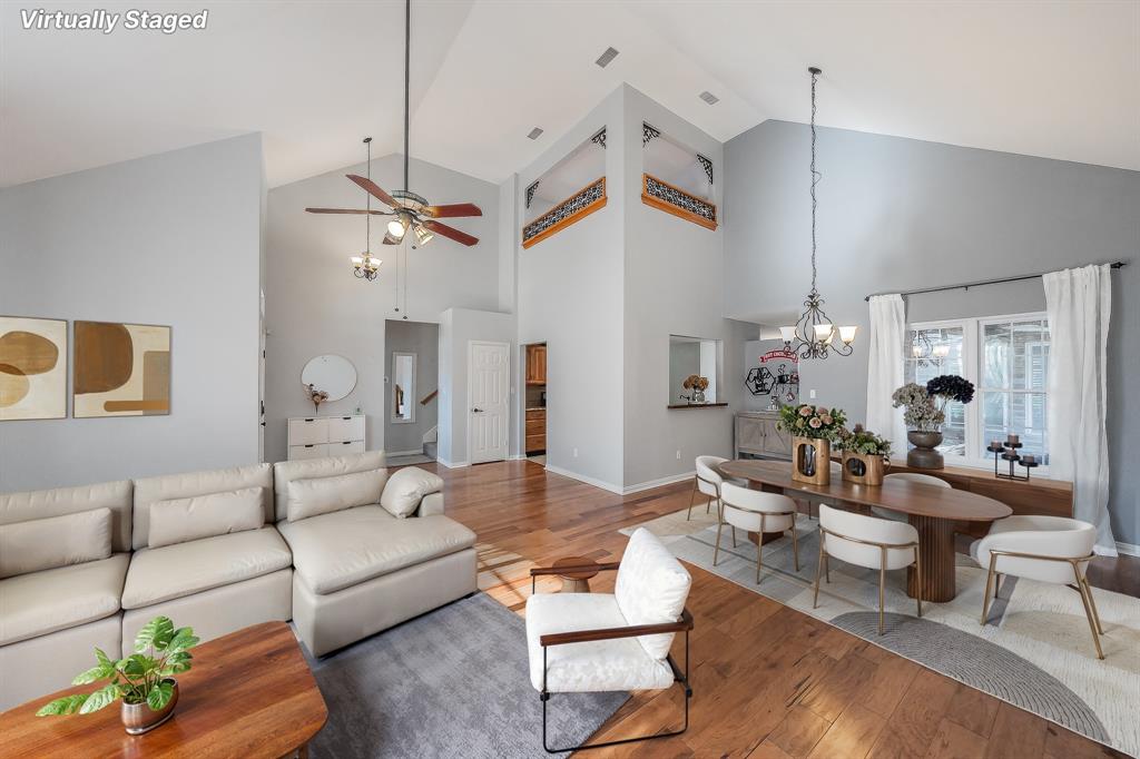 4425 Maple Shade Avenue Sachse, TX 75048 - Photo 5 of 40 a living room with lots of furniture and a chandelier
