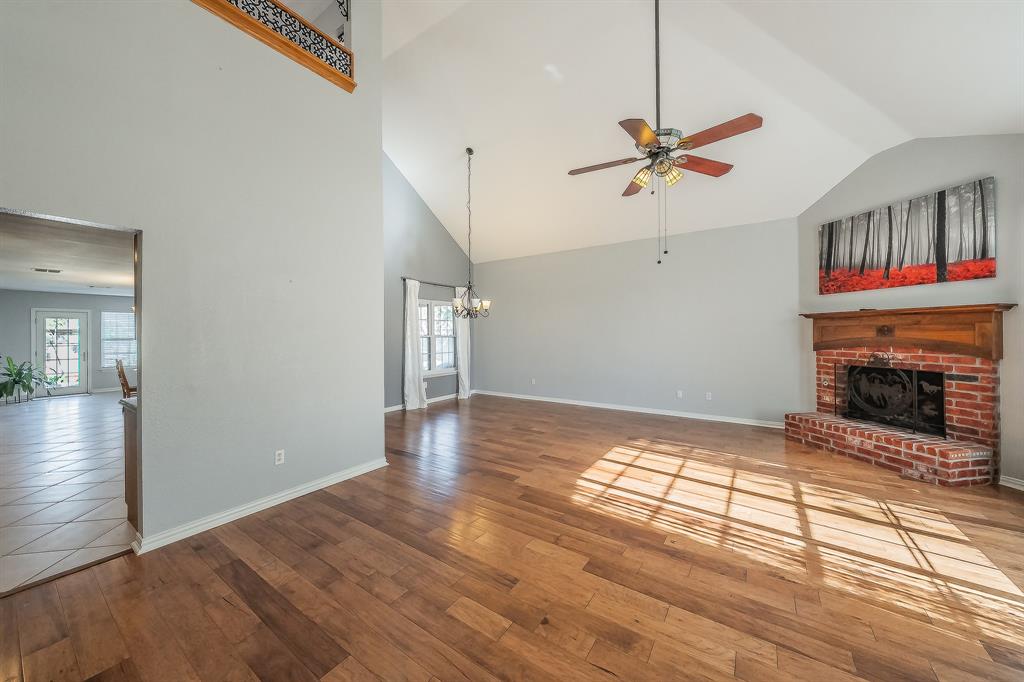 4425 Maple Shade Avenue Sachse, TX 75048 - Photo 8 of 40 an empty room with windows and fireplace