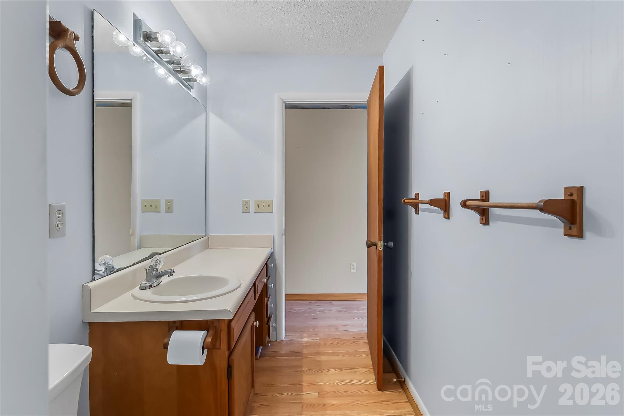 350 Sandy Bottom Road Marshall, NC 28753 - Photo 13 of 40 a bathroom with a sink and mirror