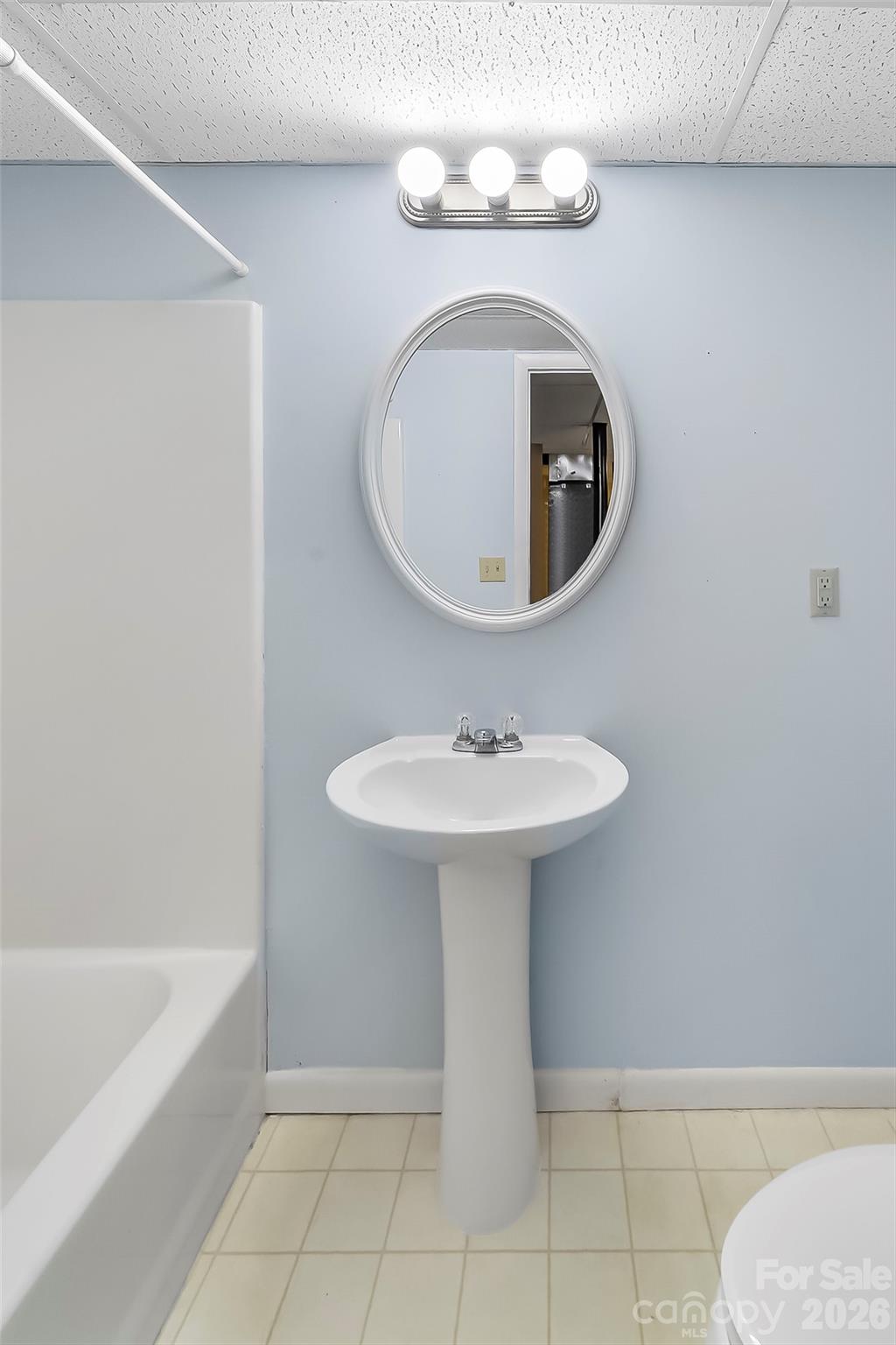 350 Sandy Bottom Road Marshall, NC 28753 - Photo 14 of 40 a bathroom with a sink toilet and bathtub