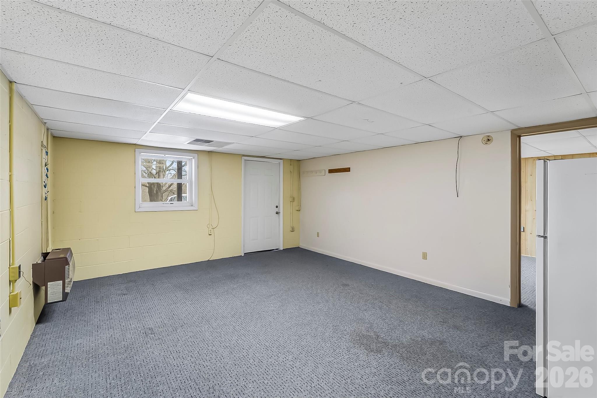 350 Sandy Bottom Road Marshall, NC 28753 - Photo 17 of 40 a view of an empty room with a window