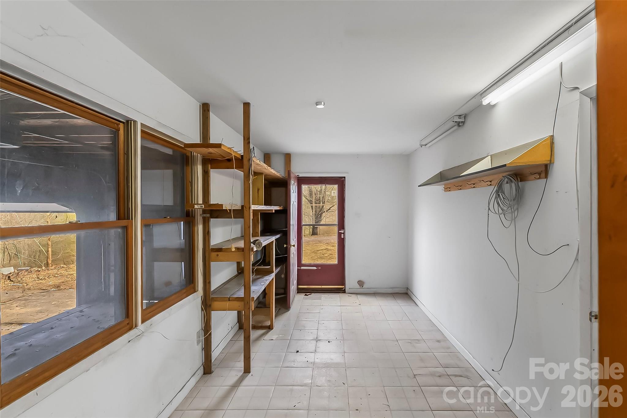350 Sandy Bottom Road Marshall, NC 28753 - Photo 21 of 40 a view of walk in closet with clothes and shoes