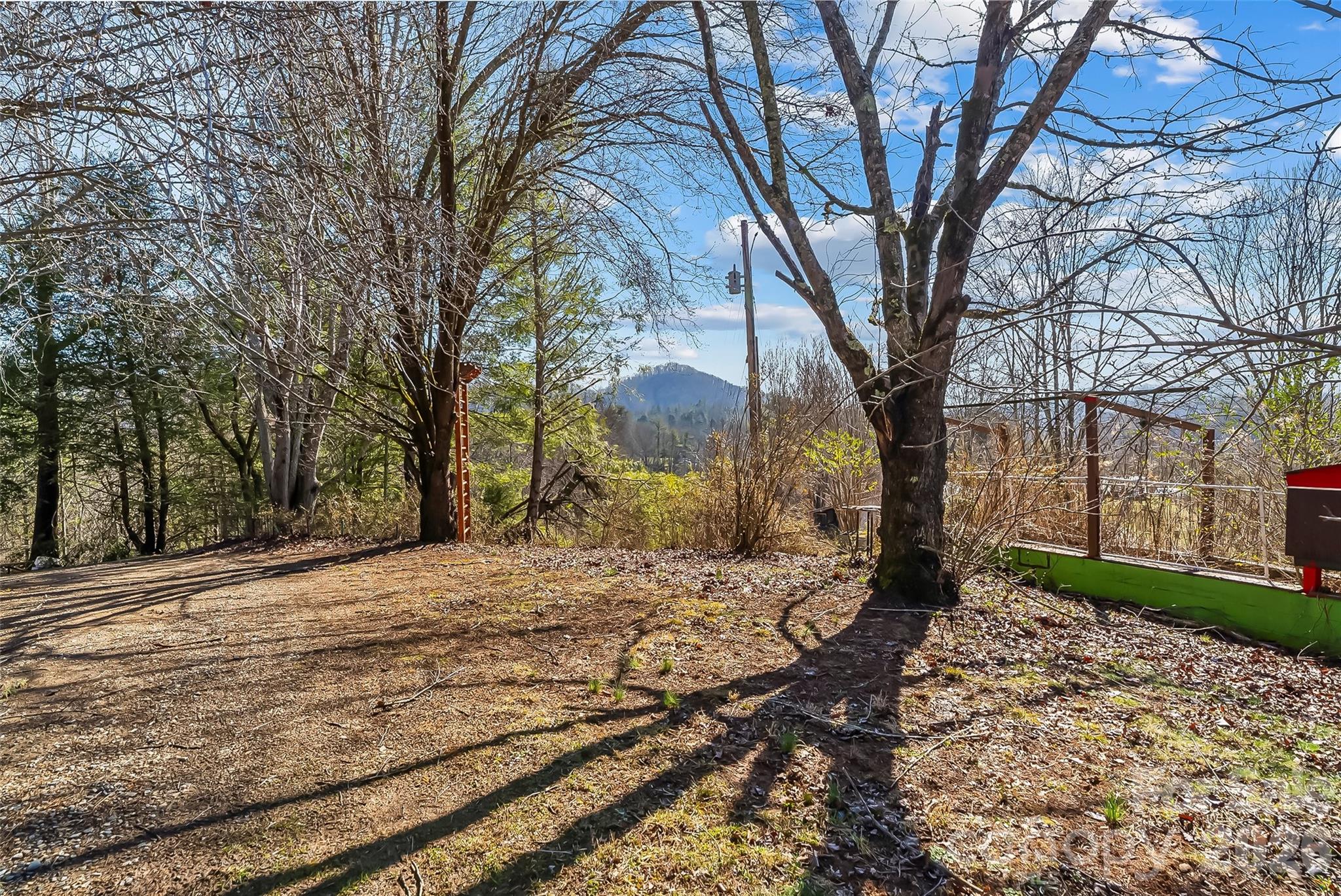 350 Sandy Bottom Road Marshall, NC 28753 - Photo 31 of 40 a wooden bench sitting in front of a house