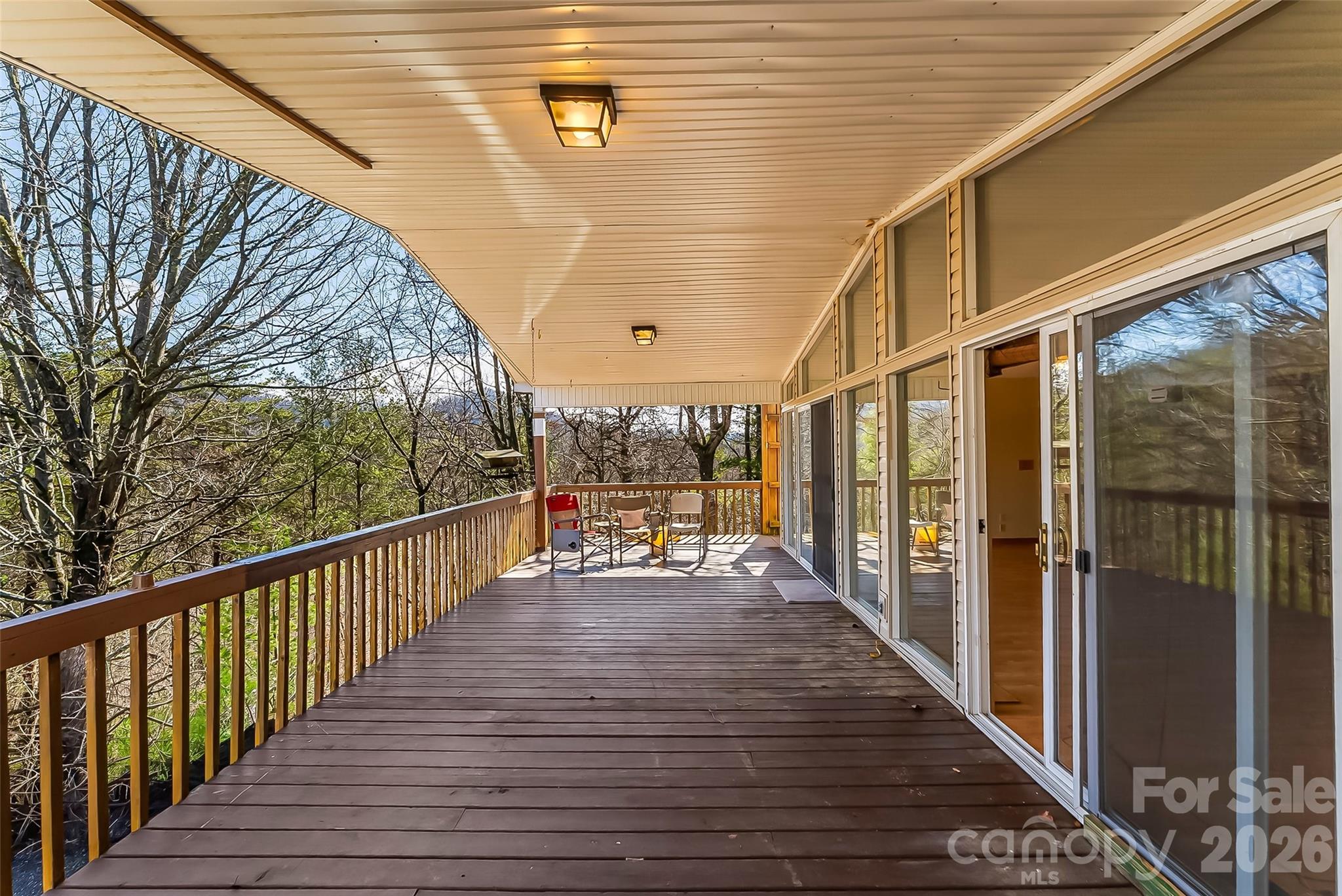 350 Sandy Bottom Road Marshall, NC 28753 - Photo 8 of 40 a view of a balcony with wooden floor