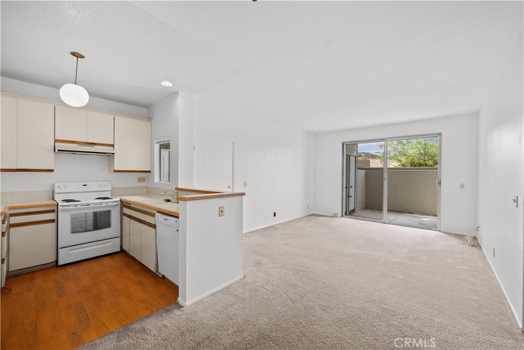 27645 Susan Beth Way, Unit A Saugus, CA 91350 - Photo 7 of 26 a kitchen with a stove oven and sink