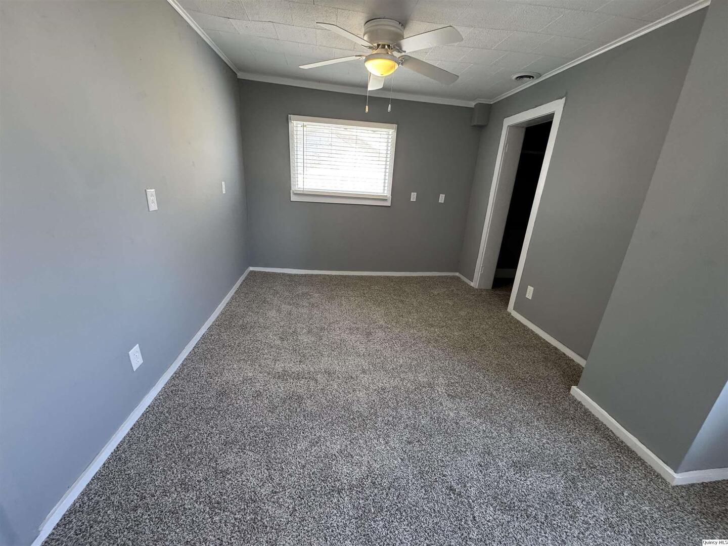 605 Adams Street Quincy, IL 62301 - Photo 11 of 15 an empty room with windows and entrance