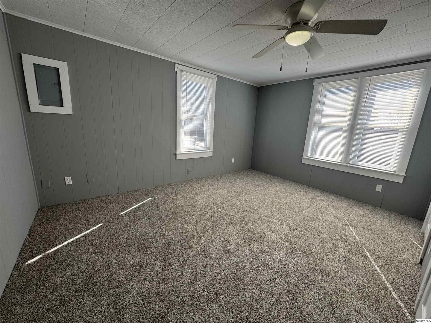605 Adams Street Quincy, IL 62301 - Photo 8 of 15 a view of an empty room with a window