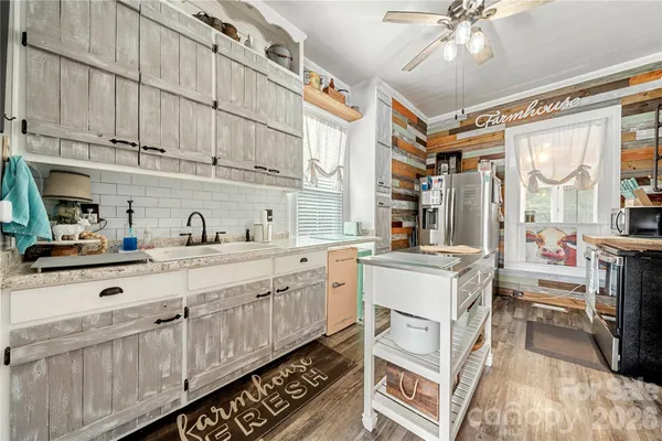 a kitchen with stainless steel appliances granite countertop a stove and a sink