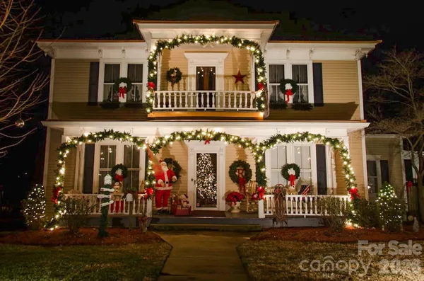 a view of a house with a yard and garage