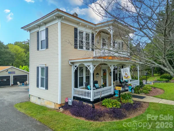 an aerial view of a house with a yard basket ball court and outdoor seating
