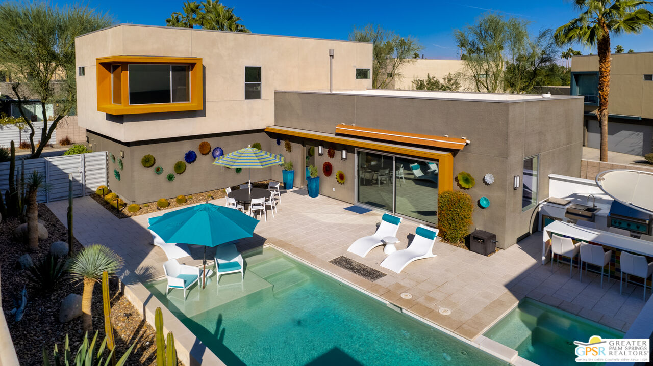 1069 Dane Drive Palm Springs, CA 92262 - Photo 1 of 51 a front view of a house with garden and porch