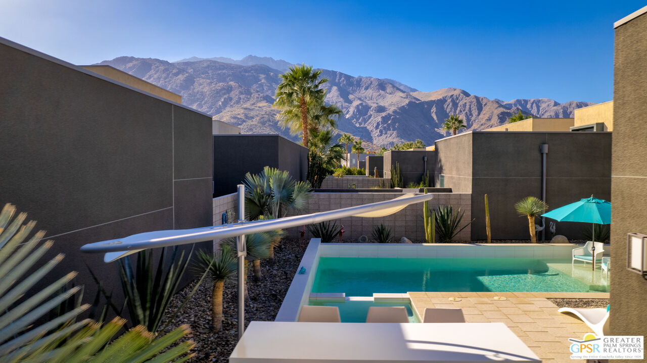 1069 Dane Drive Palm Springs, CA 92262 - Photo 12 of 51 a view of a house with a yard and a garden