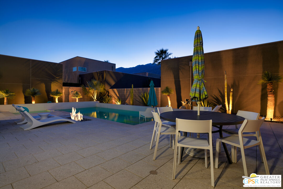 1069 Dane Drive Palm Springs, CA 92262 - Photo 19 of 51 a view of a chairs and table in the patio