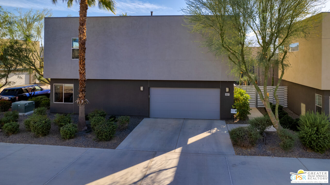 1069 Dane Drive Palm Springs, CA 92262 - Photo 21 of 51 a front view of a house with garden