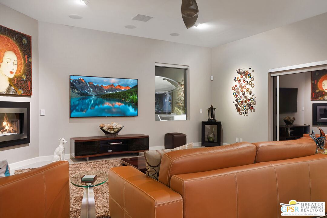 1069 Dane Drive Palm Springs, CA 92262 - Photo 25 of 51 a living room with furniture and a flat screen tv