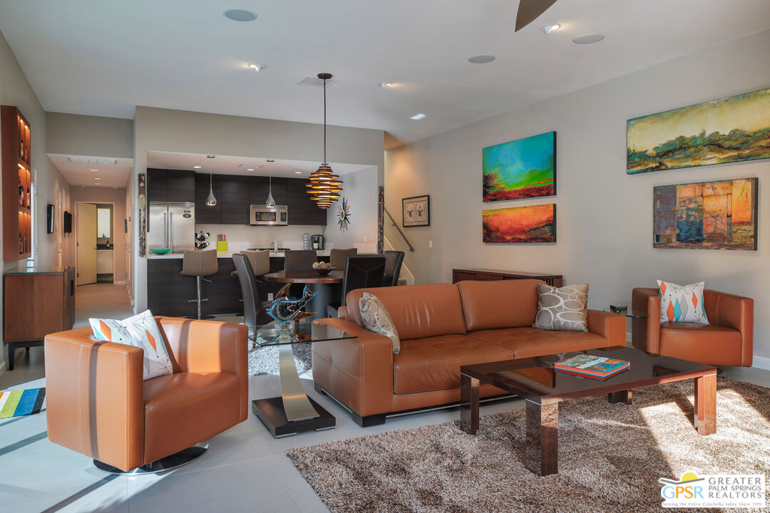 1069 Dane Drive Palm Springs, CA 92262 - Photo 32 of 51 a living room with furniture kitchen view and a wooden floor