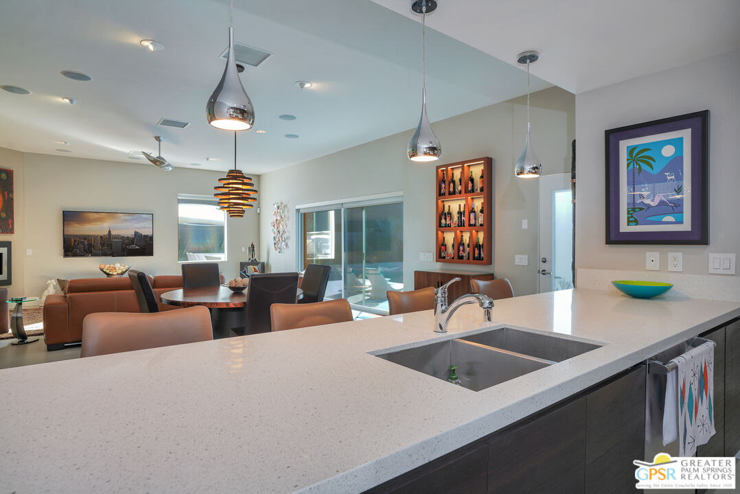 1069 Dane Drive Palm Springs, CA 92262 - Photo 35 of 51 a view of a kitchen counter top space with furniture and a chandelier