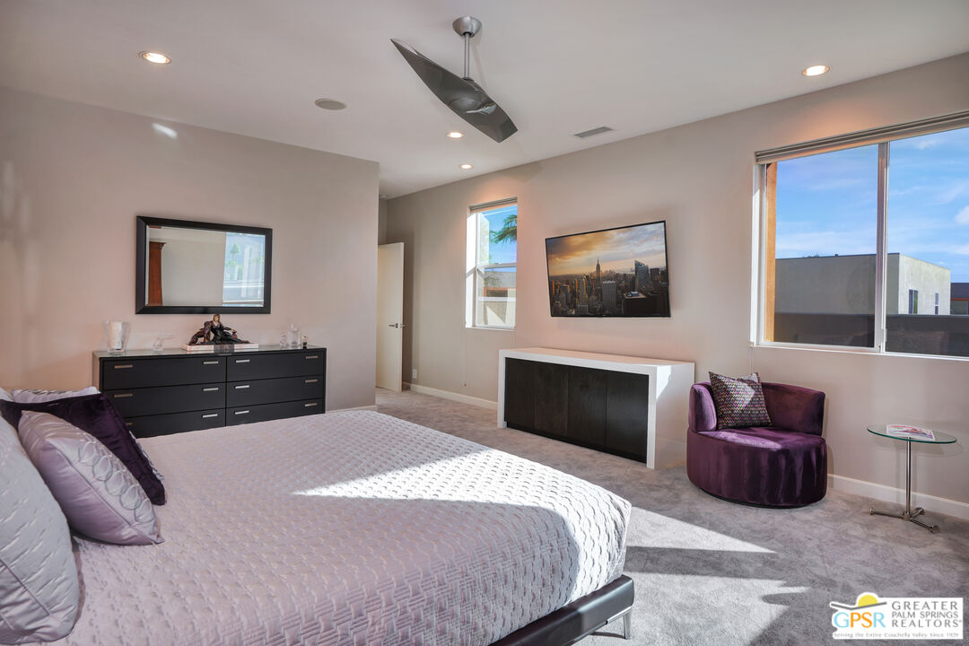 1069 Dane Drive Palm Springs, CA 92262 - Photo 40 of 51 a bedroom with a bed and glass wall