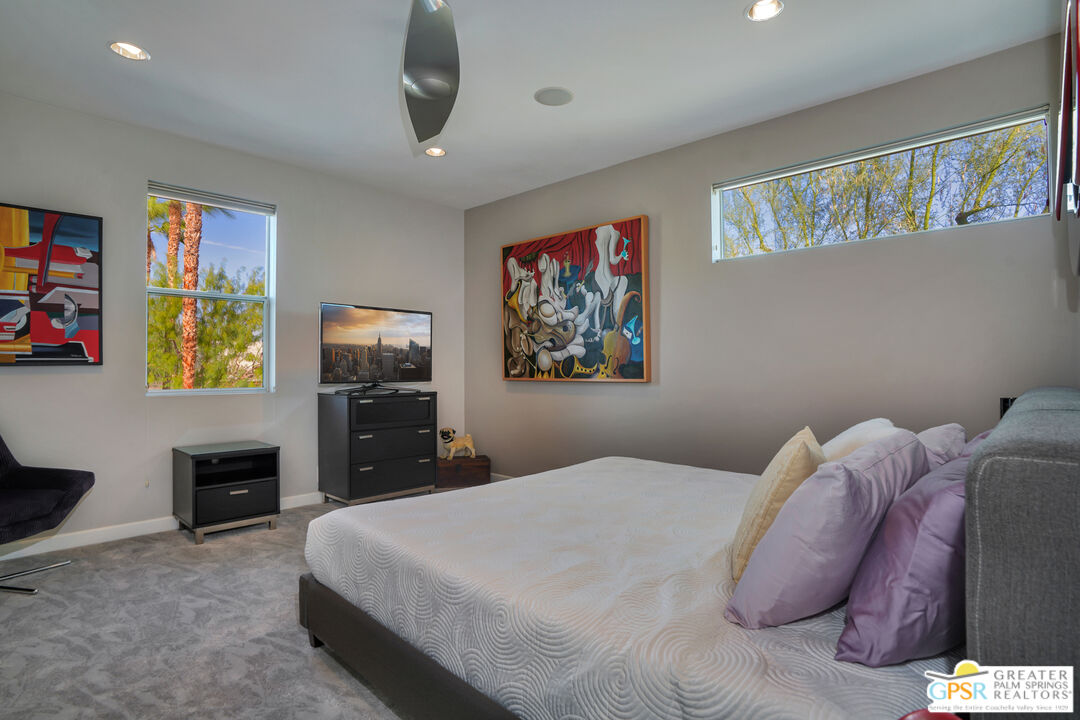 1069 Dane Drive Palm Springs, CA 92262 - Photo 46 of 51 a bedroom with a bed and a desk