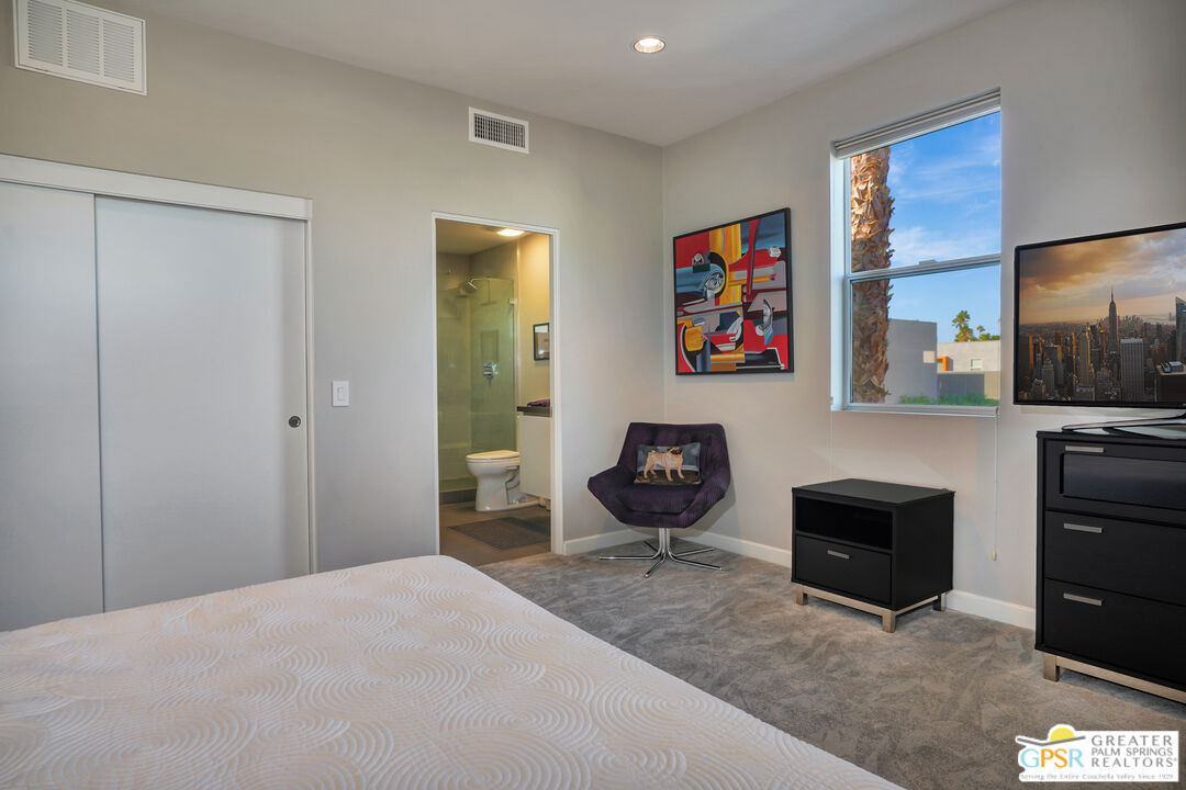 1069 Dane Drive Palm Springs, CA 92262 - Photo 47 of 51 a bedroom with a bed and furniture
