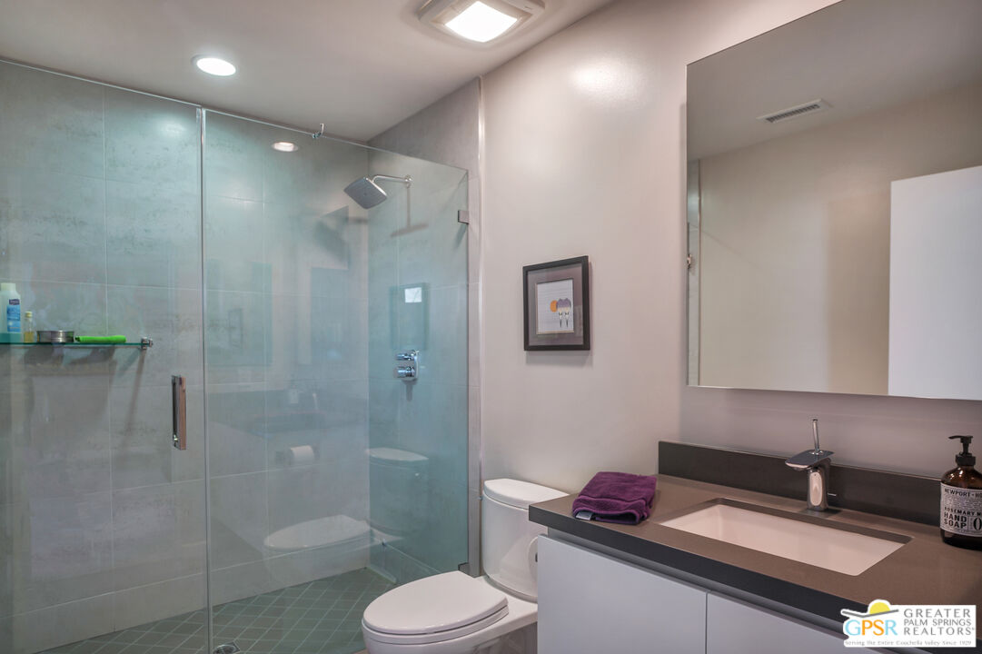 1069 Dane Drive Palm Springs, CA 92262 - Photo 48 of 51 a bathroom with a granite countertop sink toilet and shower