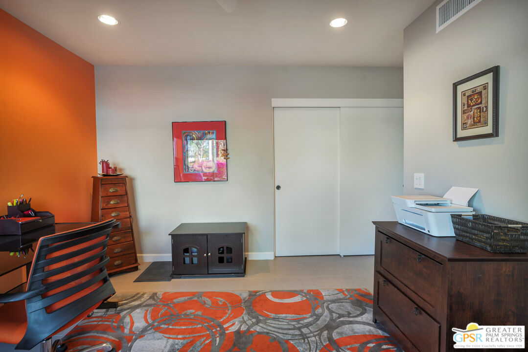 1069 Dane Drive Palm Springs, CA 92262 - Photo 50 of 51 a bed room with furniture and a lamp