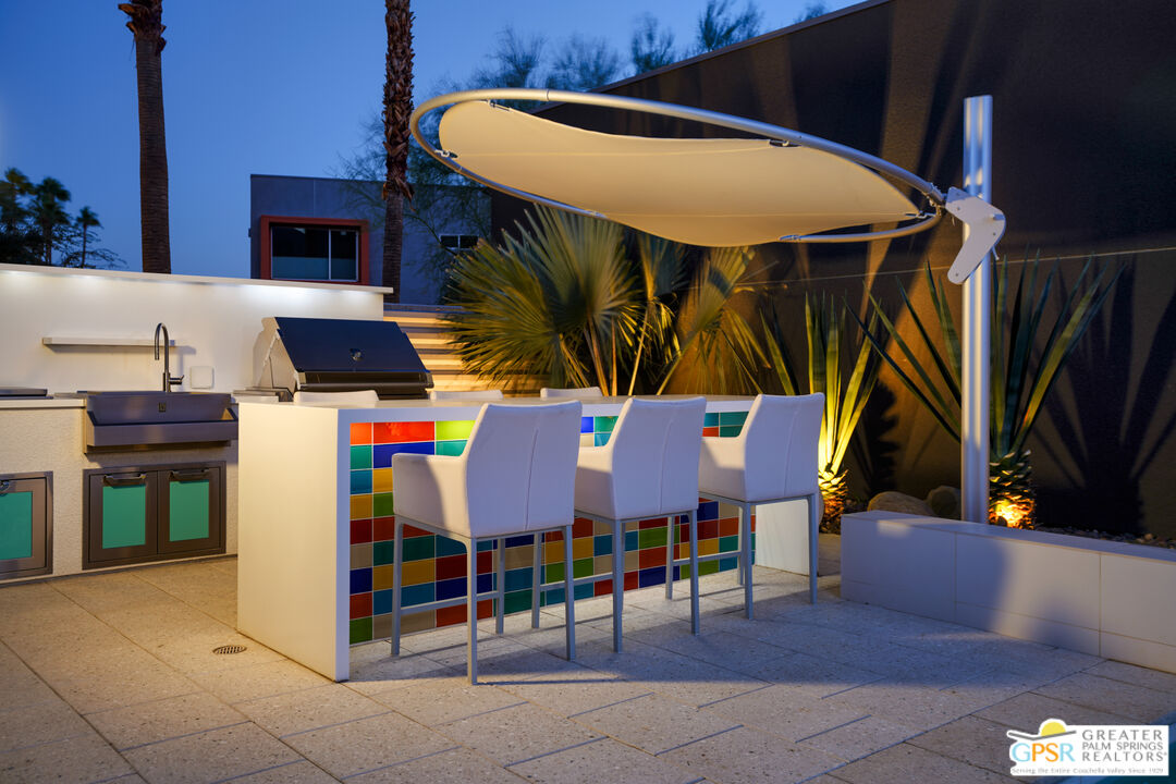 1069 Dane Drive Palm Springs, CA 92262 - Photo 10 of 51 a group of people sitting in a yard