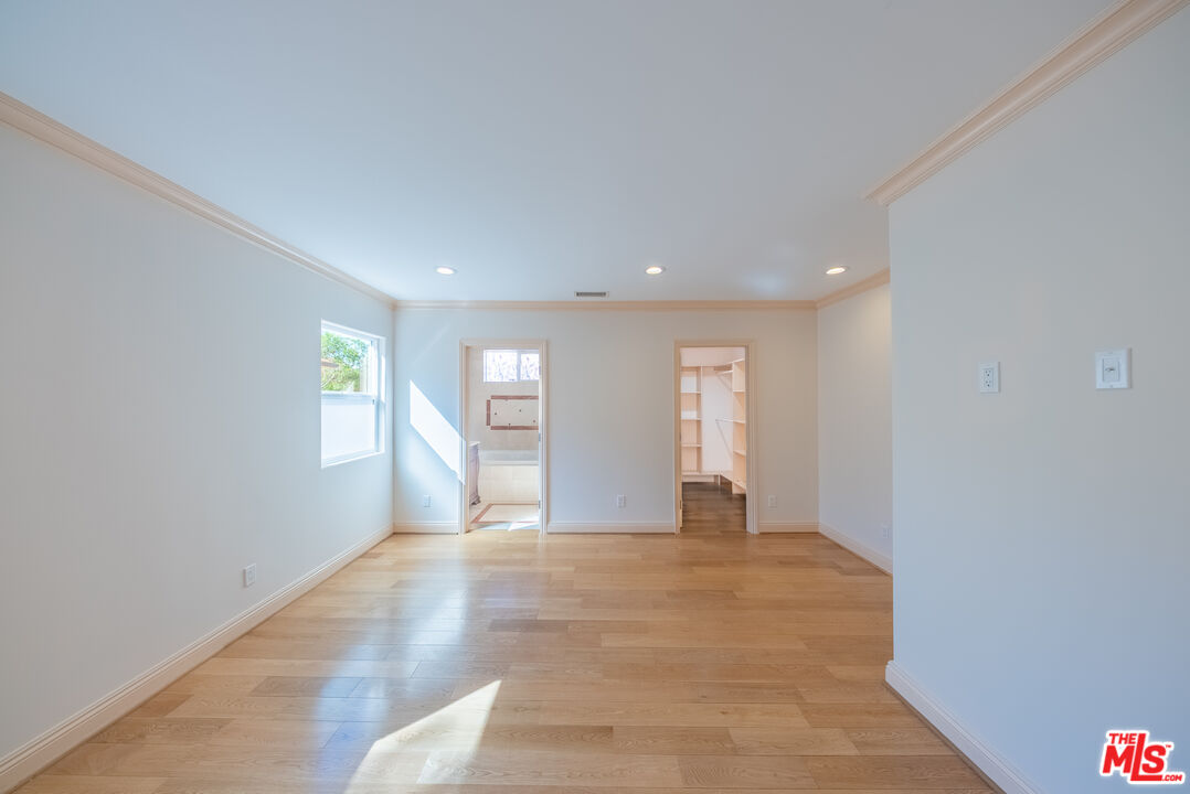 13847 Gilmore Street Van Nuys, CA 91401 - Photo 18 of 43 a view of an empty room with a window