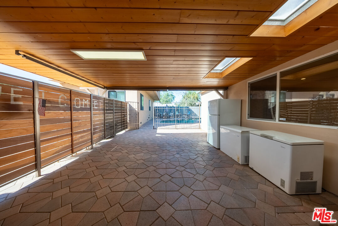 13847 Gilmore Street Van Nuys, CA 91401 - Photo 19 of 43 a view of backyard with large window