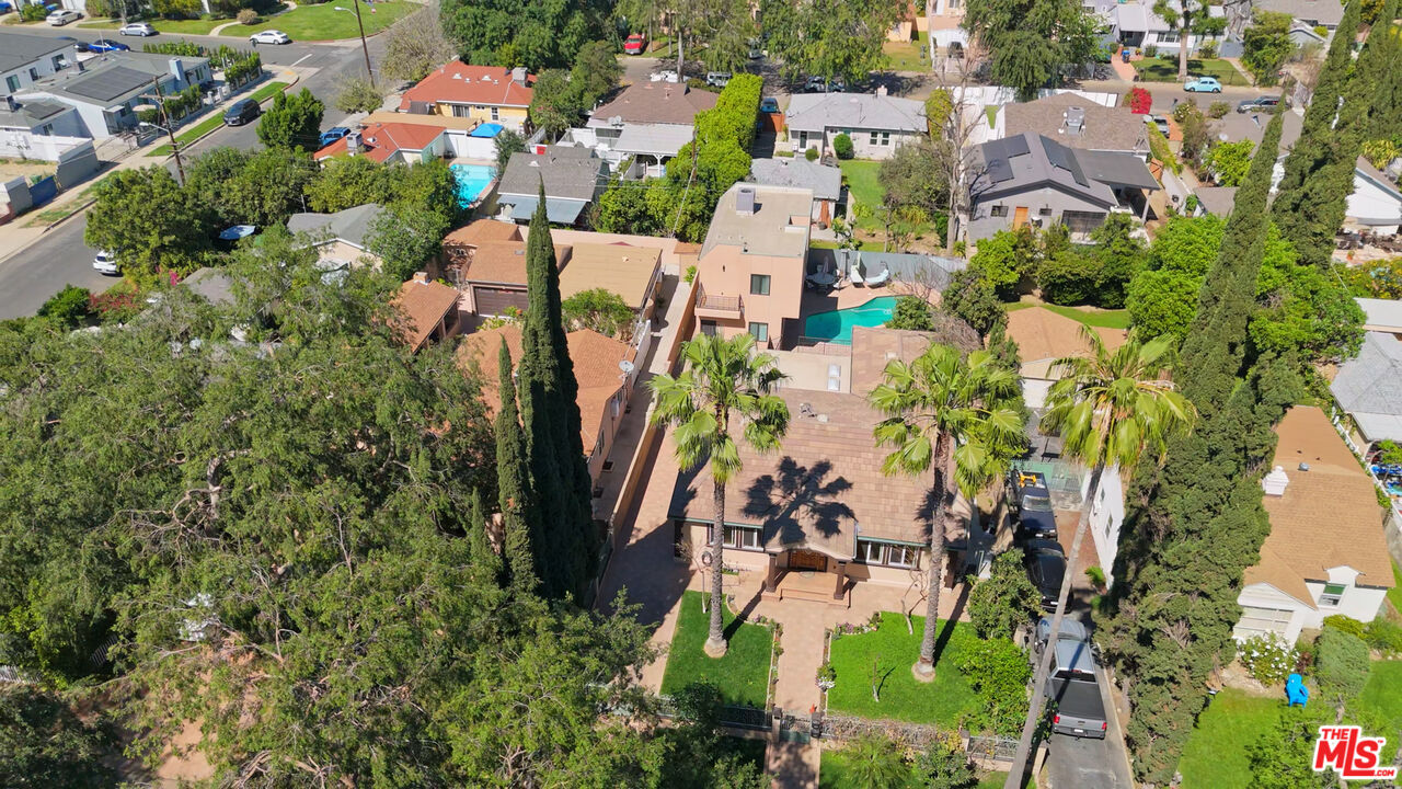 13847 Gilmore Street Van Nuys, CA 91401 - Photo 23 of 43 an aerial view of residential houses with outdoor space and trees