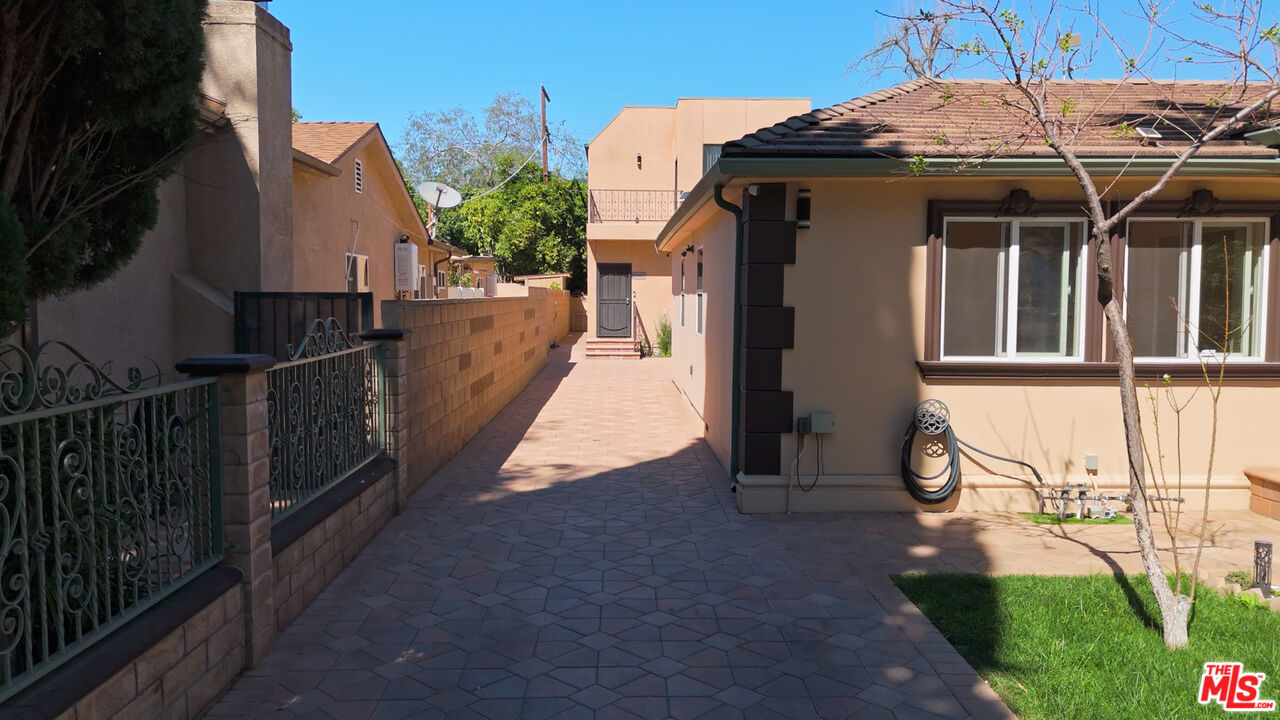 13847 Gilmore Street Van Nuys, CA 91401 - Photo 24 of 43 a view of a house with wooden fence