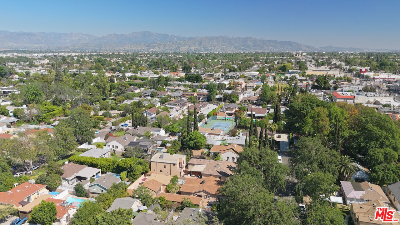 13847 Gilmore Street Van Nuys, CA 91401 - Photo 27 of 43 an aerial view of residential houses with outdoor space and trees