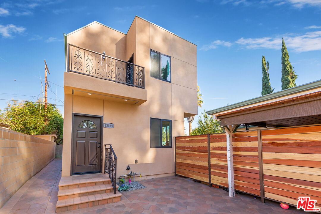 13847 Gilmore Street Van Nuys, CA 91401 - Photo 32 of 43 a backyard of a house with dishwasher and entertaining space