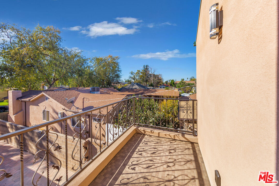13847 Gilmore Street Van Nuys, CA 91401 - Photo 43 of 43 a view of a balcony with wooden floor and city view