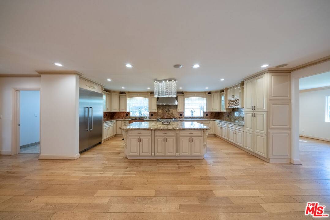 13847 Gilmore Street Van Nuys, CA 91401 - Photo 5 of 43 a view of kitchen with kitchen island
