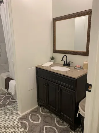 a bathroom with a sink and a mirror