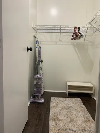 a bedroom with a bed and cabinets