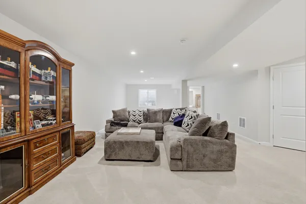 a living room with furniture and large window
