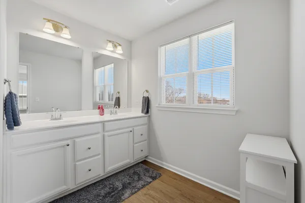 a bathroom with a sink and a window