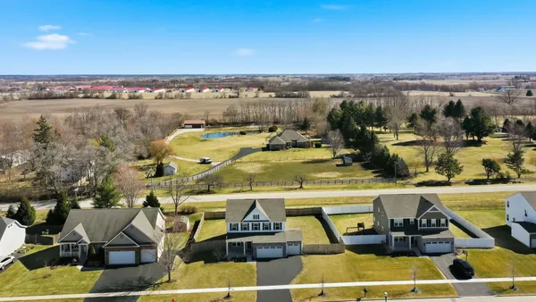 a view of a swimming pool and an outdoor seating