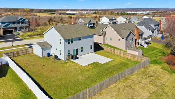a aerial view of a house with a swimming pool